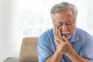 Senior Man with Toothache