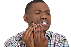 Young Man With Tooth Pain Symptoms
